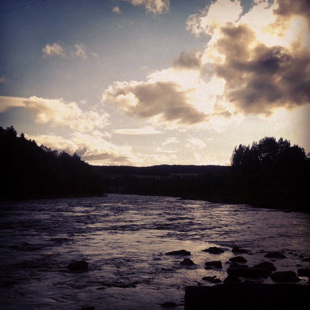 Norway, Tolga. Fishing in the river...